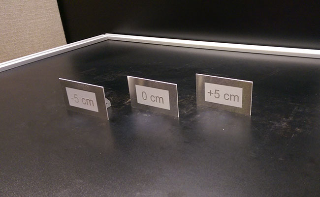 Figure 2: Photograph of laser marking of three aluminum plates, located 5 cm apart from one another.