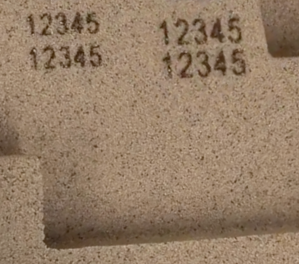 Serial numbers engraved in sand