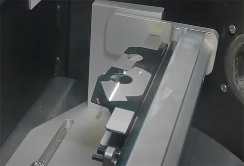 Selective laser cleaning of e-coating on metal