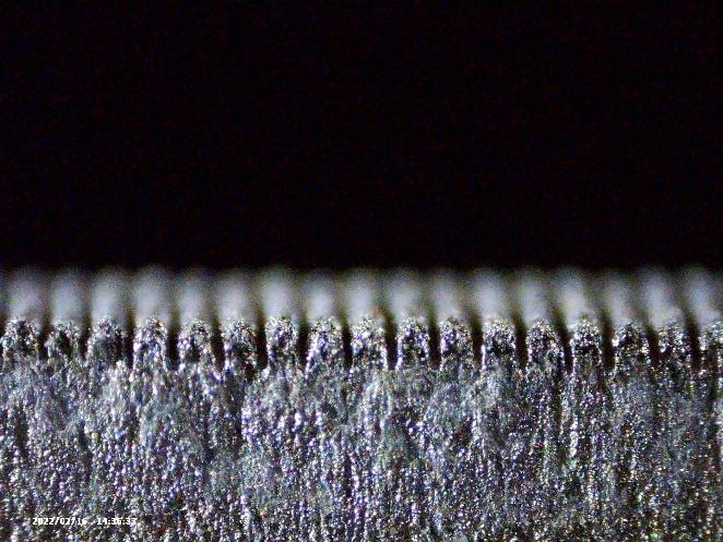 Cross section view of laser textured aluminum surface (linear pattern)