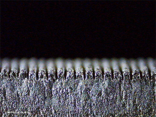 Microscopic view of a laser-textured metal surface