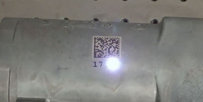 Metal part engraved by a laser
